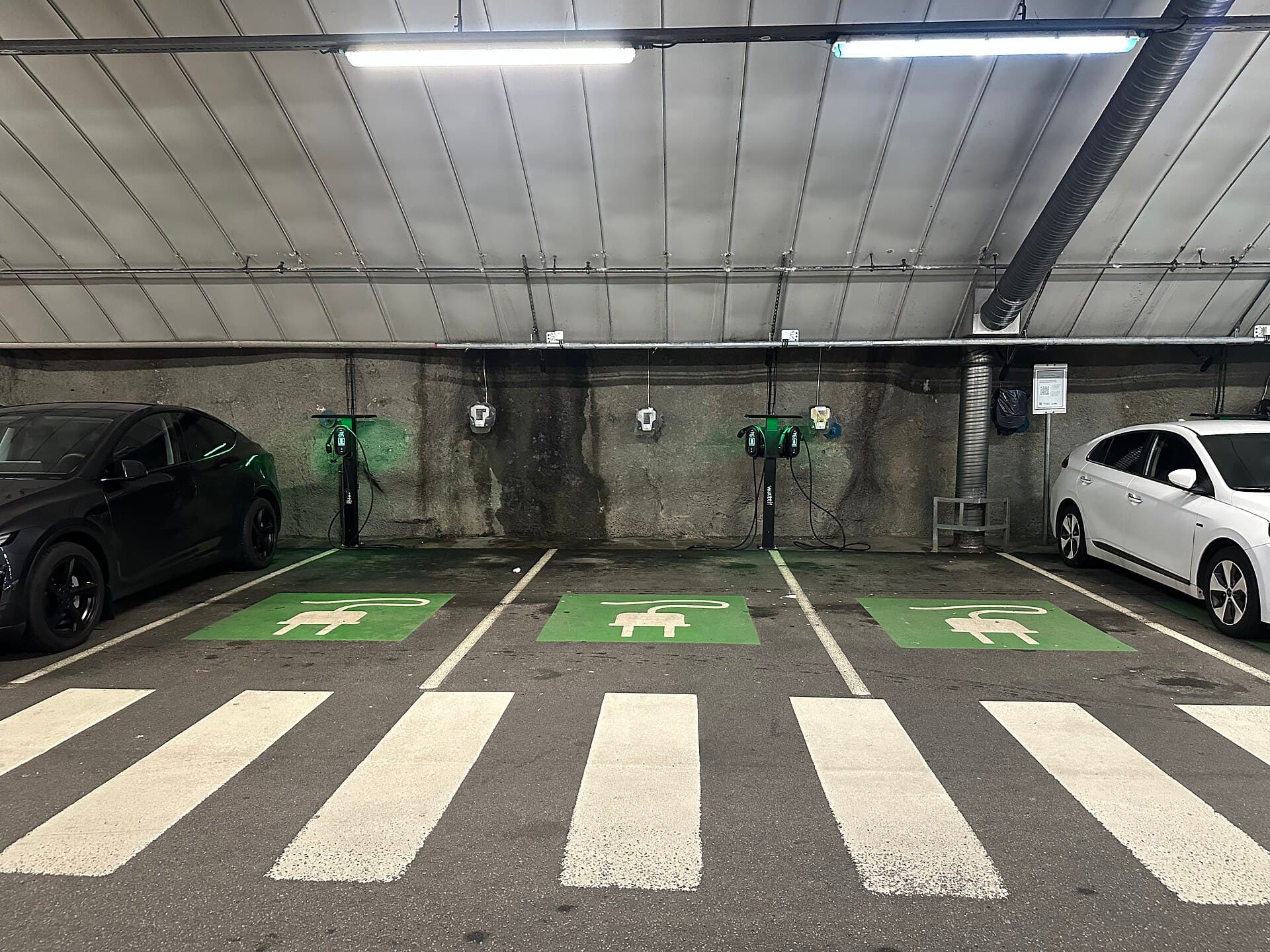 Underground parking garage equipped with several EV charging stations